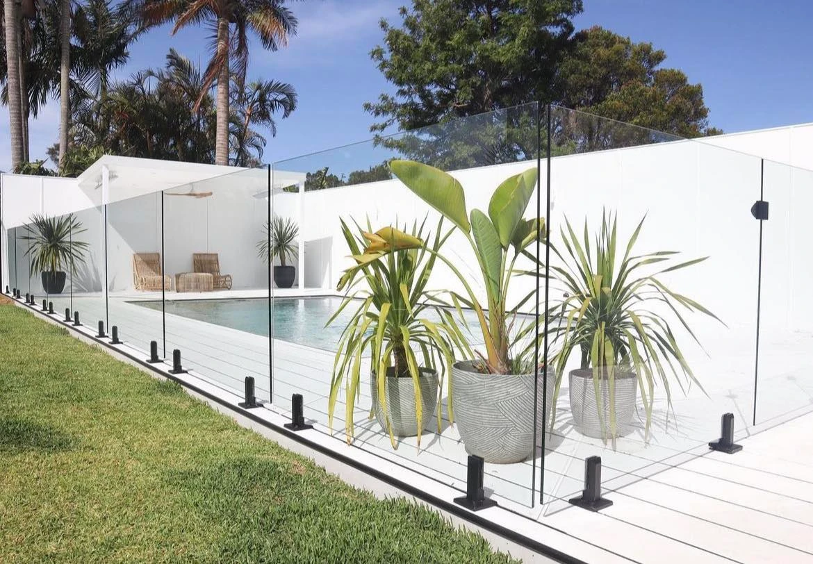 
								Black spigots mounted frameless glass pool fencing